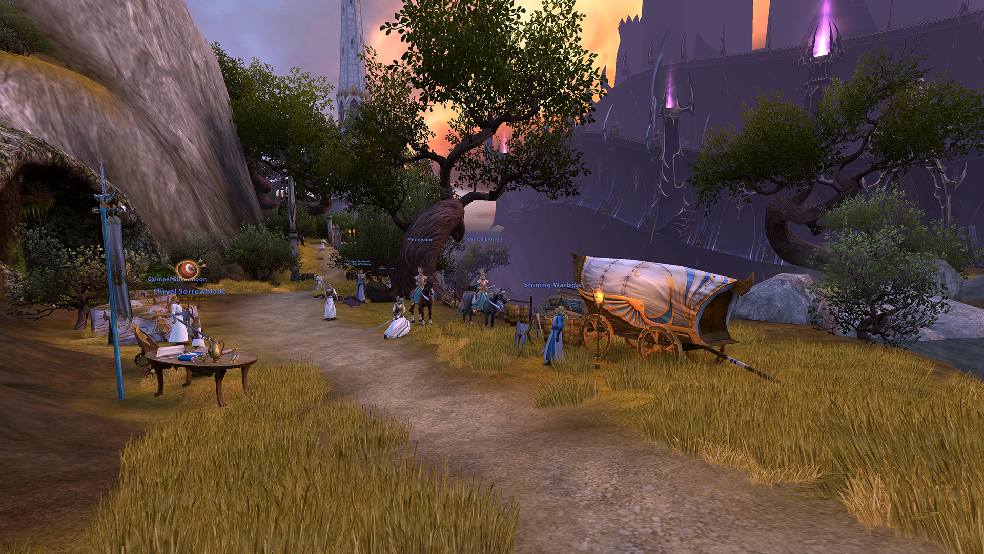 Warhammer Online High Elf area screenshot with NPCs, banners, and Dark Elf architecture in the distance.